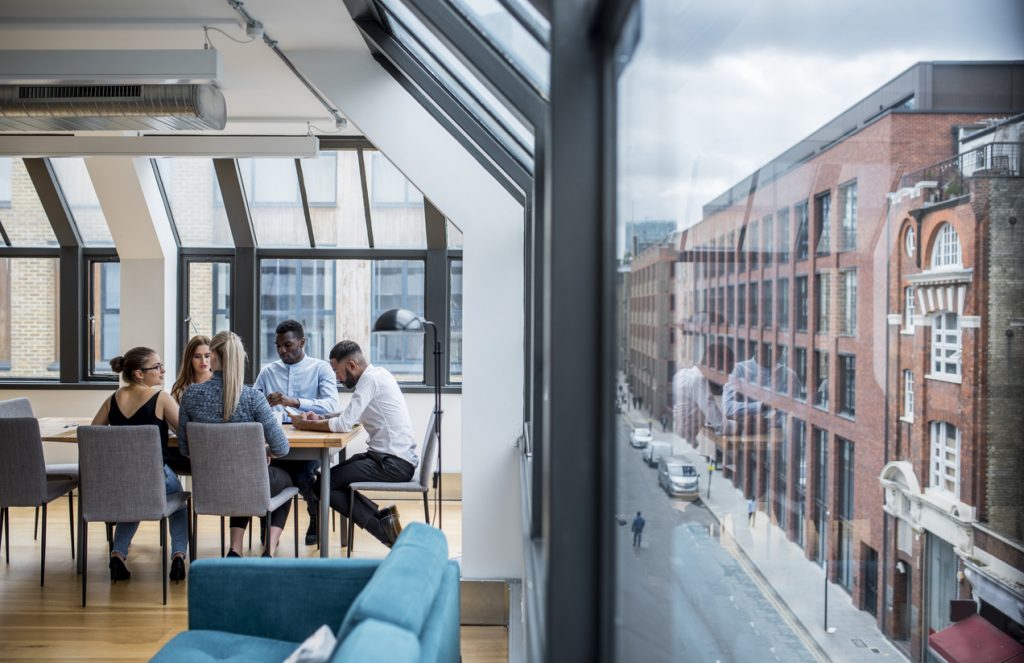 Businesspeople brainstorming new ideas in the board room